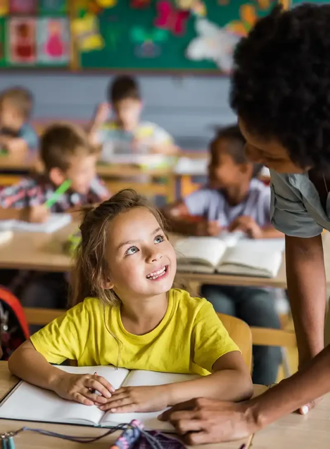 Teacher in classroom with kids
